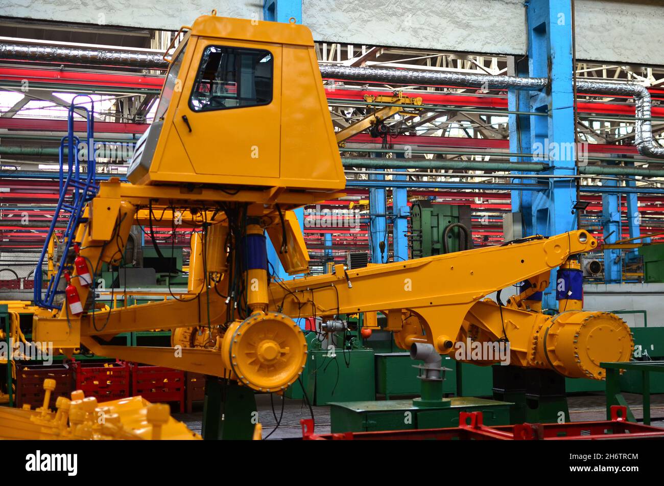 Production process of heavy mining trucks at the factory. Dump truck on ...