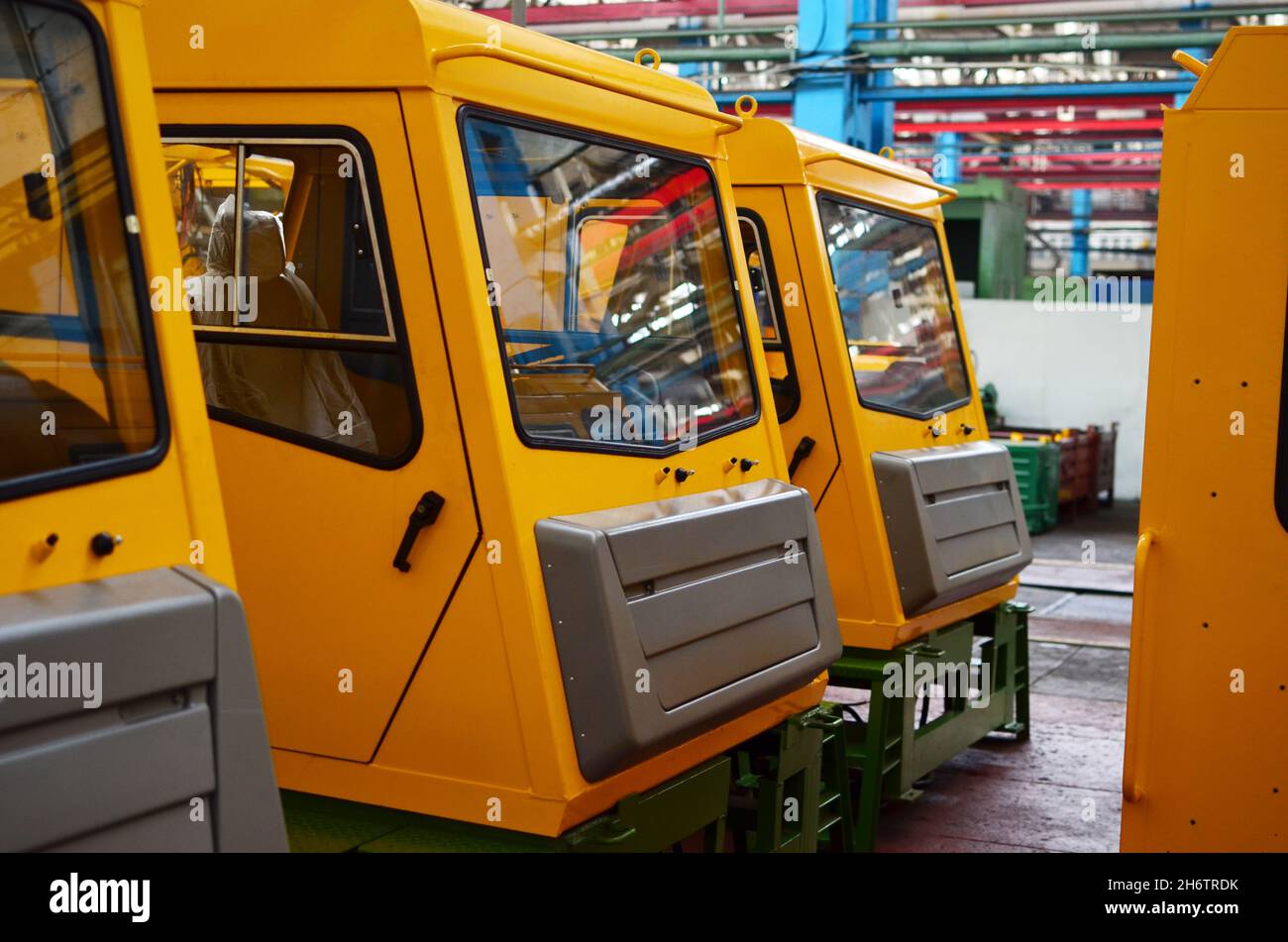 Production process of heavy mining trucks at the factory. Dump truck on ...