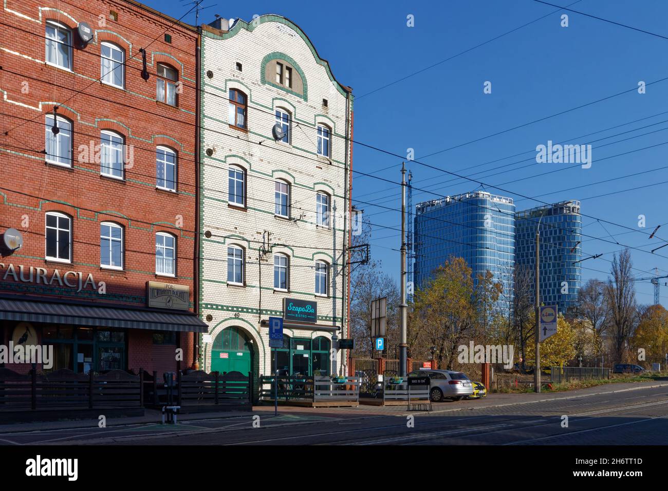 Historic buidligns of Zaleze district of Katowice (SL) with the new Global Offfice Park in the background. Stock Photo