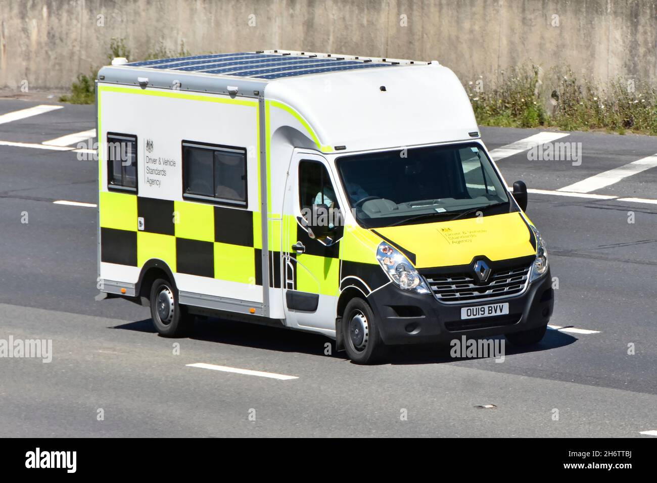 Side & front view Renault chassis cab van converted into mobile unit to accommodate staff of Driver & Vehicle Standards Agency driving on UK motorway Stock Photo