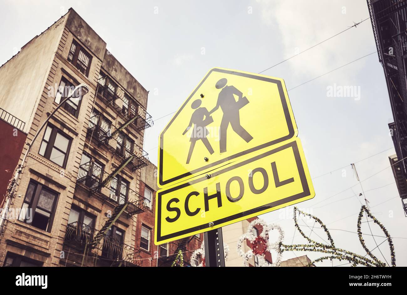 School crossing sign in New York City, color toning applied, USA. Stock Photo
