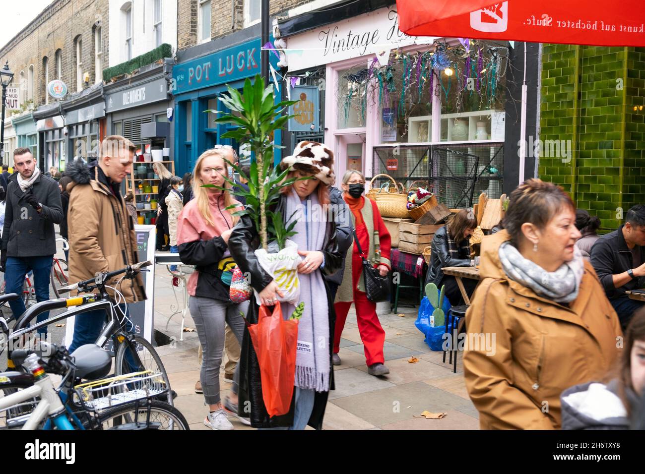 Columbia Road Flower Market people buying plants flowers in the street