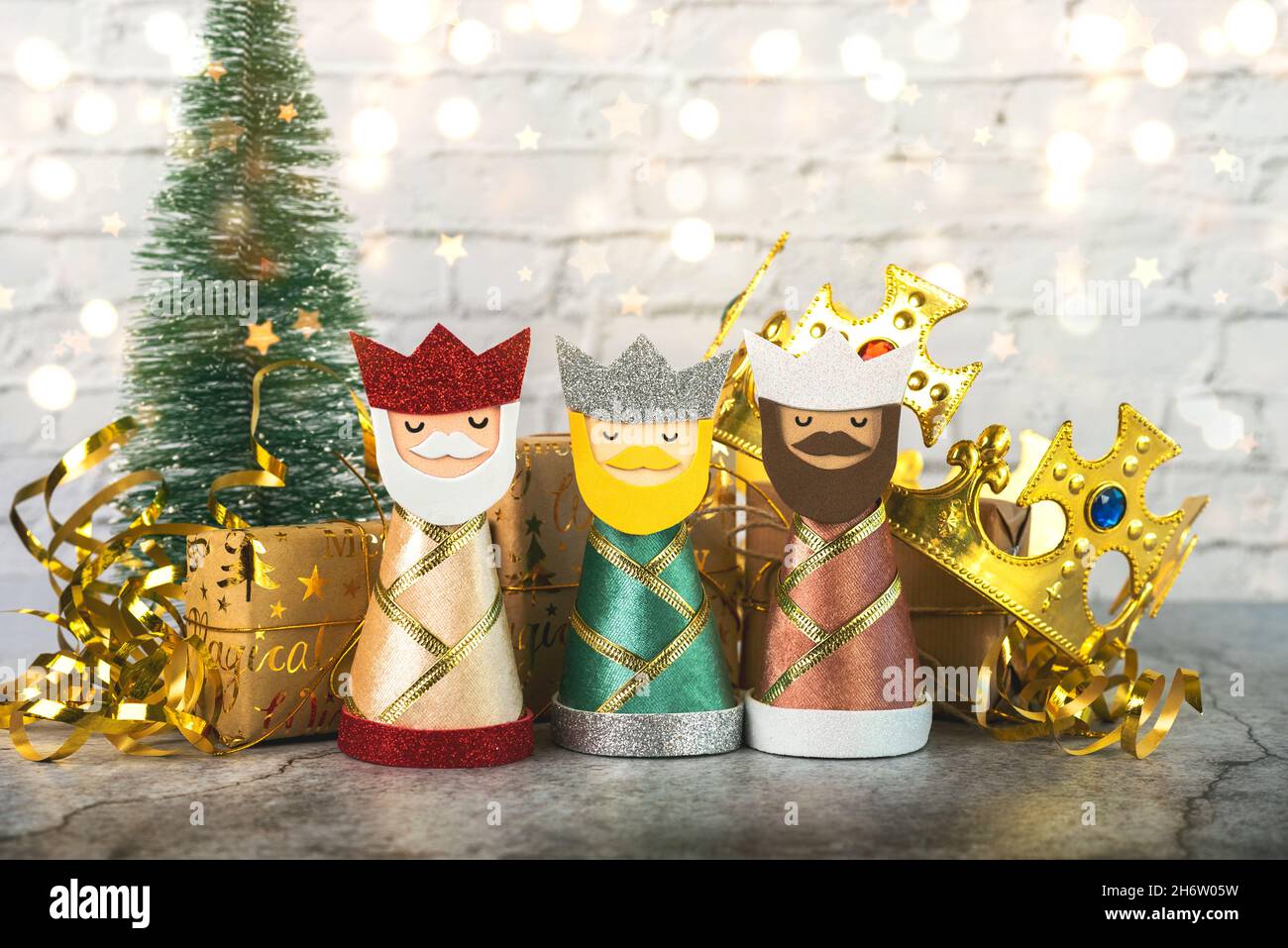 The three wise men with christmas ornaments on brick background. Concept for Dia de Reyes Magos day,Three Wise Men Stock Photo