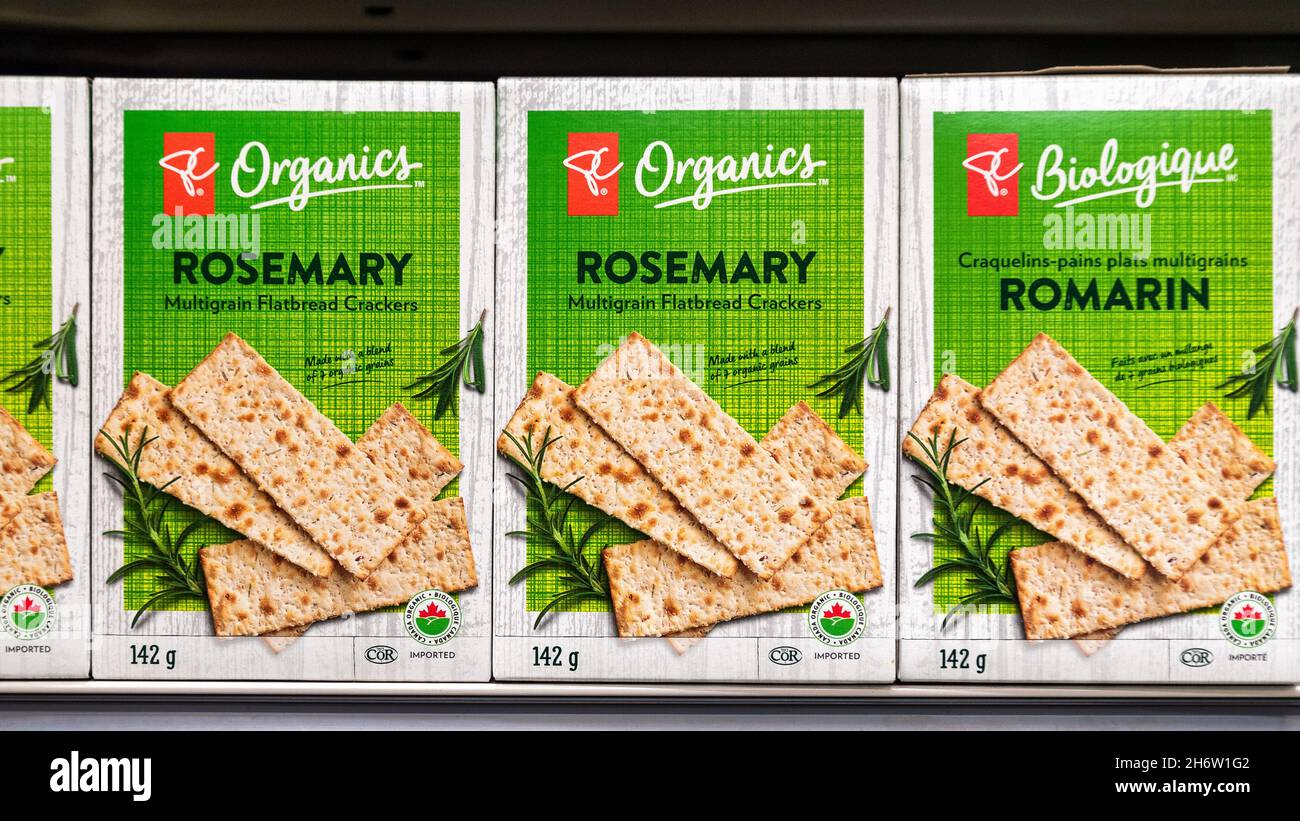 Boxes of President's Choice boxes with Rosemary crackers seen in a grocery store shelf.Nov. 18, 2021 Stock Photo