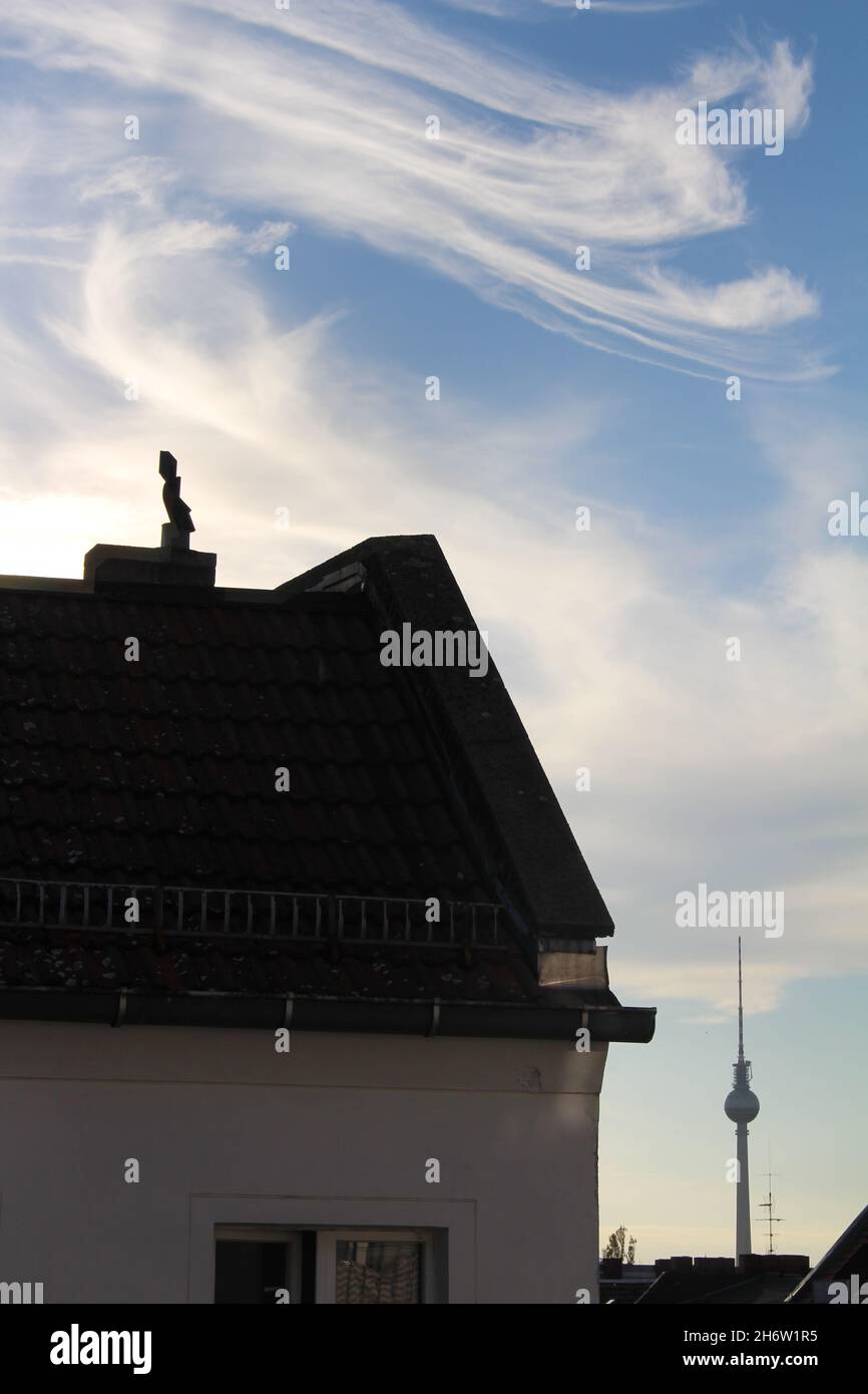 House roof with TV tower and clouds Stock Photo - Alamy