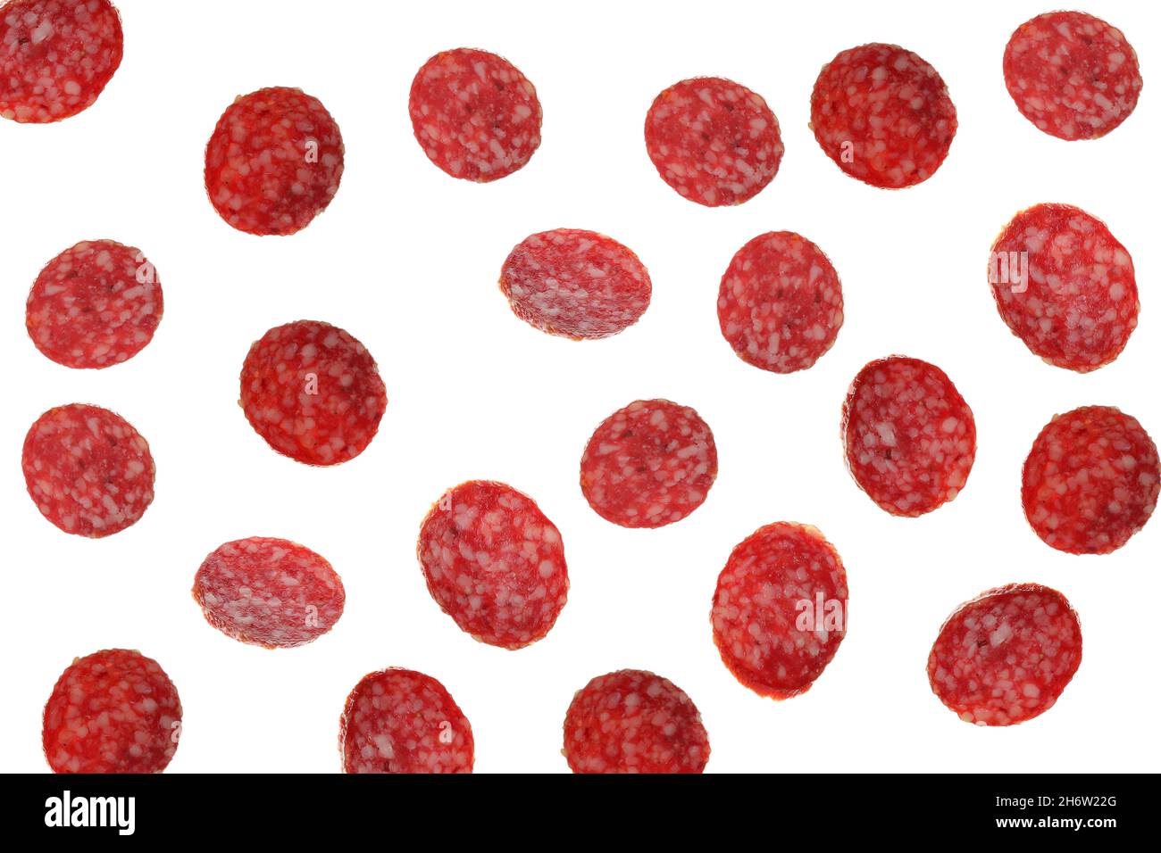 Falling salami sausage isolated on white background Stock Photo