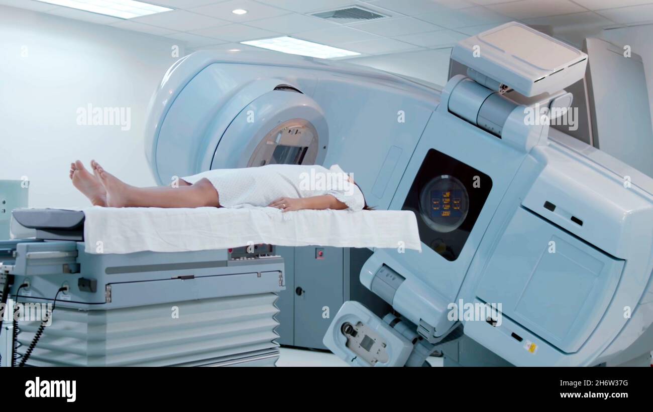 https://c8.alamy.com/comp/2H6W37G/close-up-of-a-computerized-axial-tomography-machine-with-a-woman-entering-the-machine-for-a-full-body-scan-2H6W37G.jpg