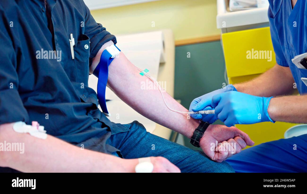 close-up of a doctor or nurse performing a blood draw on a patient Stock Photo
