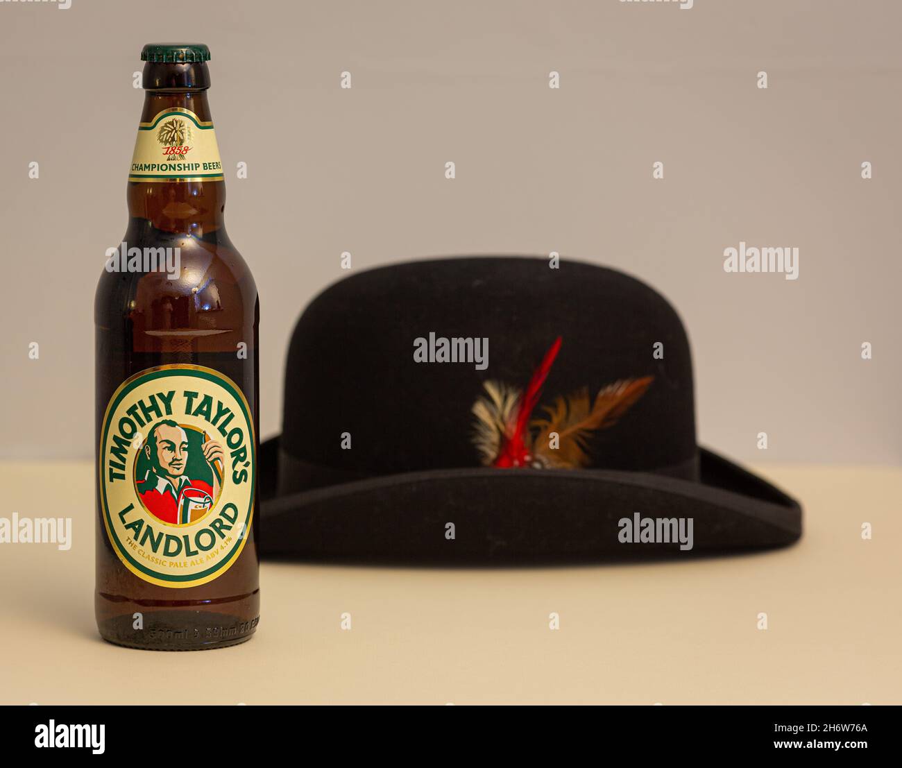 Bottle of Timothy Taylor's Landlord Pale Ale and Drayman's Hat Stock Photo