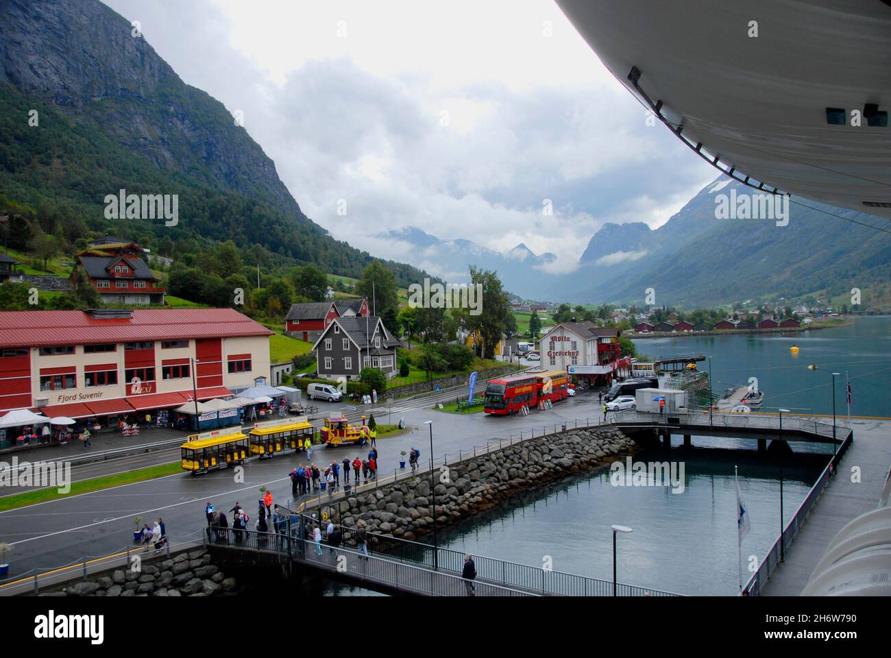 The Port Of Olden Norway With Transport Waiting To Take Cruise Ship The Port Of Olden Norway With Transport Waiting To Take Cruise Ship