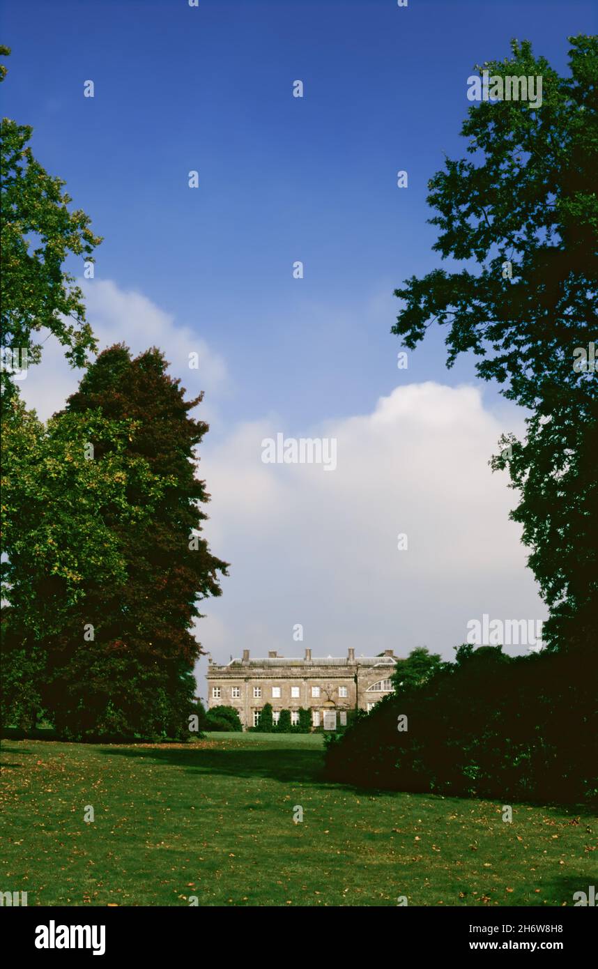 A glimpse of Stourhead House from the garden, Stourton, Wiltshire, England, UK.  Transparency film photograph from 1992. Stock Photo