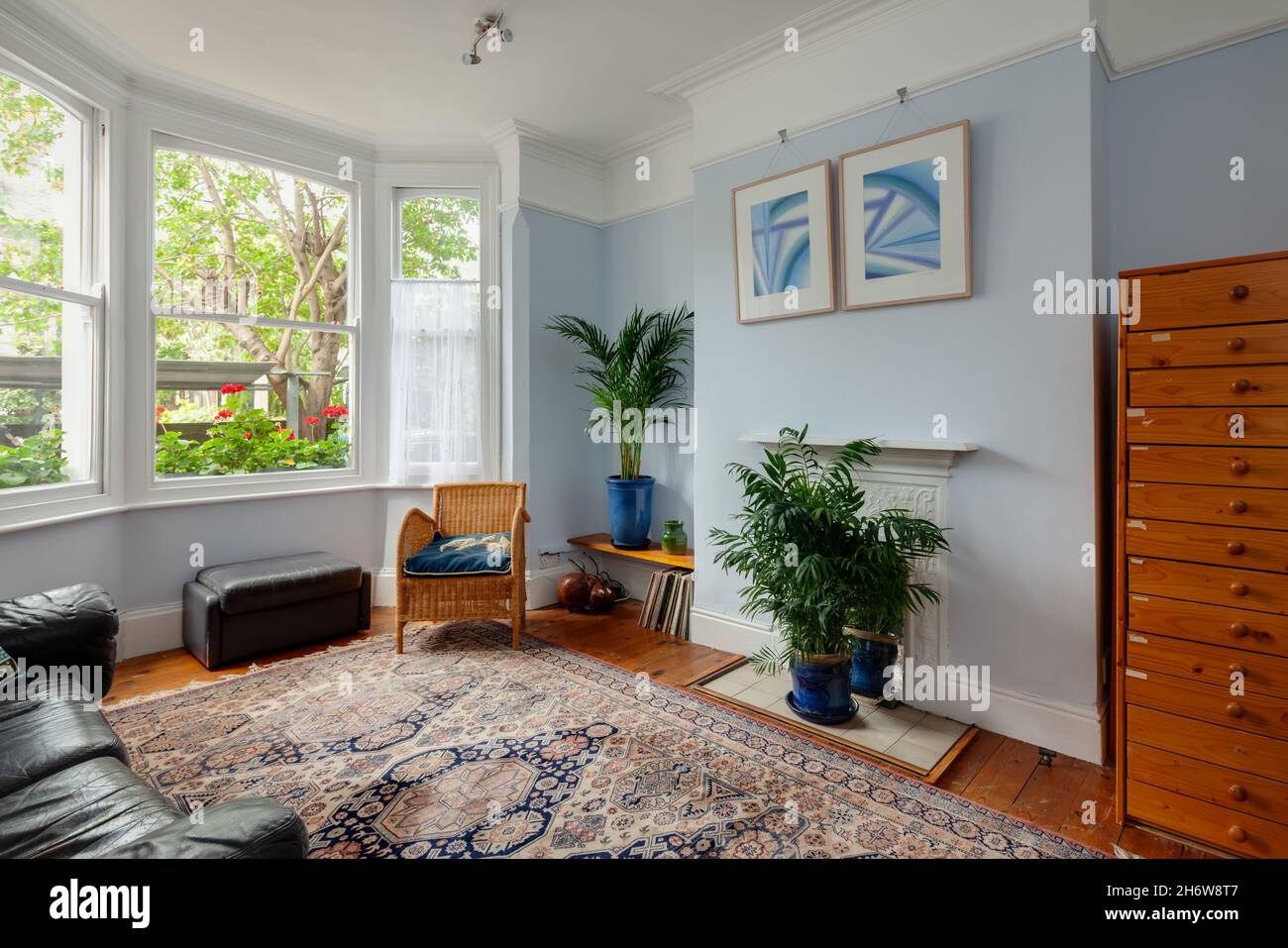 Cambridge, England - August 21 2019: Bay fronted reception room within traditional english victorian home retaining original features Stock Photo