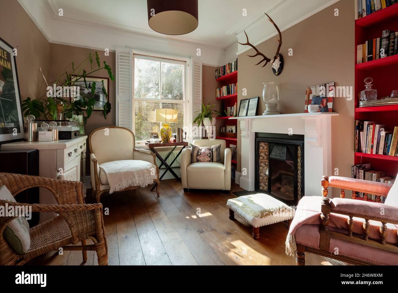 Cambridge, England  - October 28 2019 - Fashionable shabby chic cluttered sitting room within english Victorian era home Stock Photo