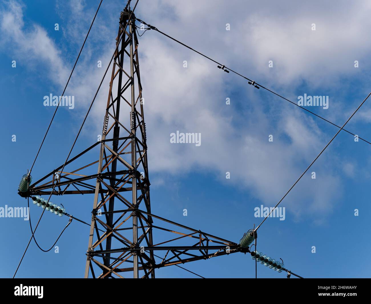 Overhead power line or overhead communication lines on a blue sky