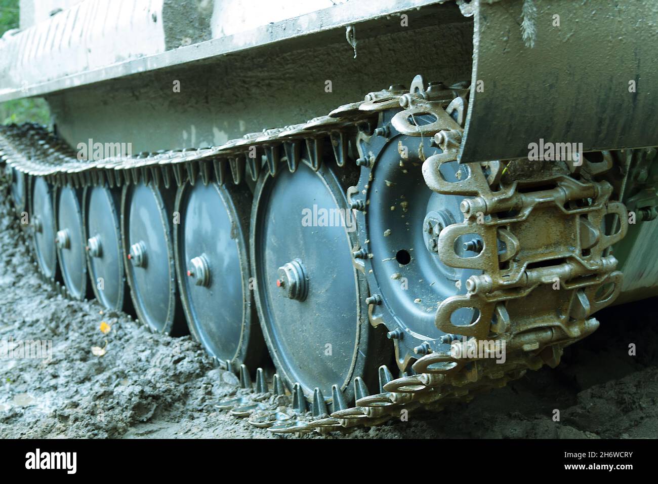 Dirty all-terrain vehicle tracks, caterpillar truck after working in swampy terrain Stock Photo