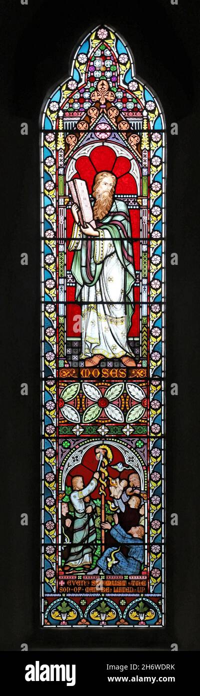 A stained glass window by Frederick Preedy depicting Moses & the Raising of a Serpent on a Pole, St Lawrence Church, Weston-Sub-Edge, Gloucestershire Stock Photo
