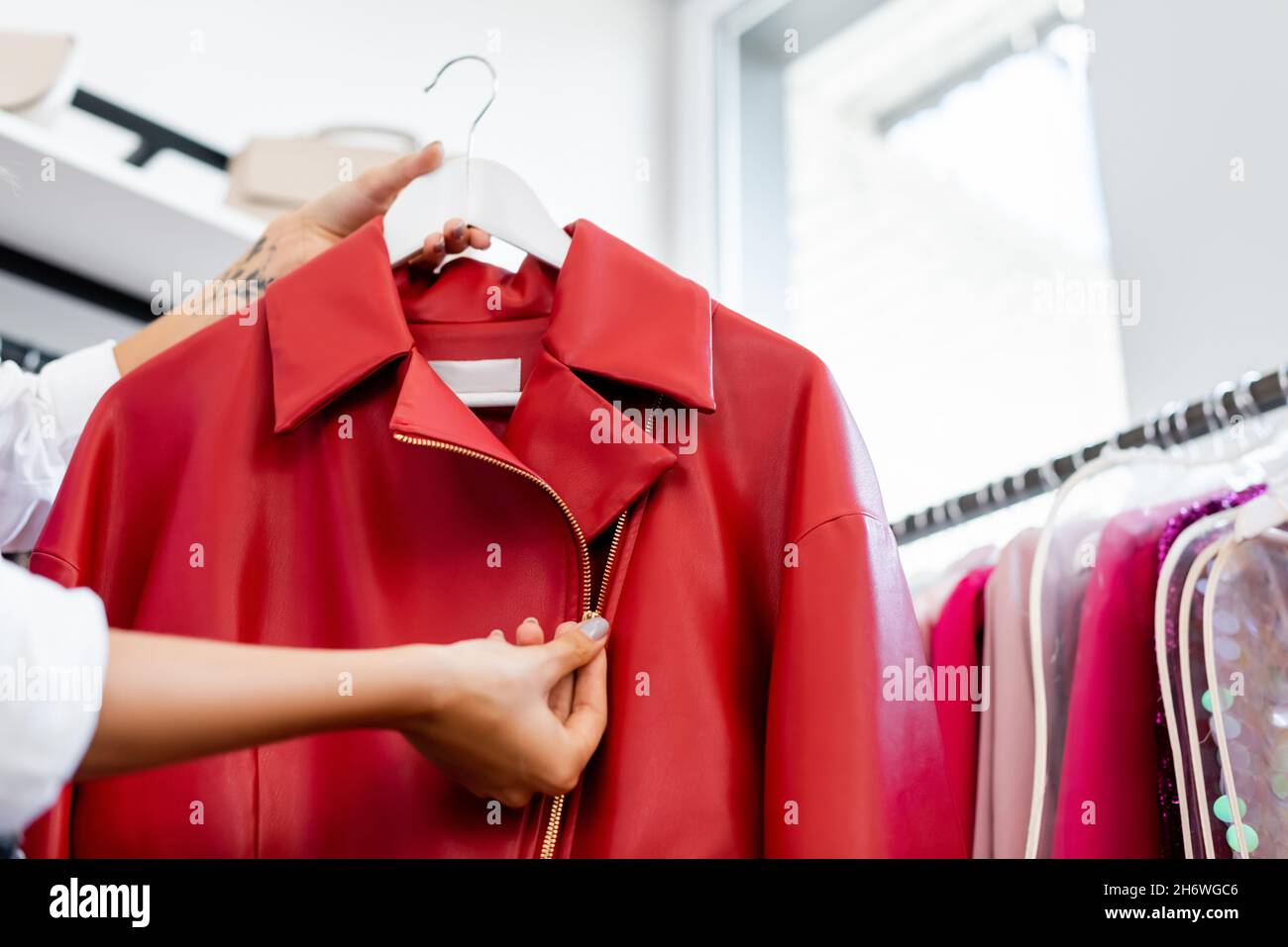 Jacket on hanger hi-res stock photography and images - Alamy