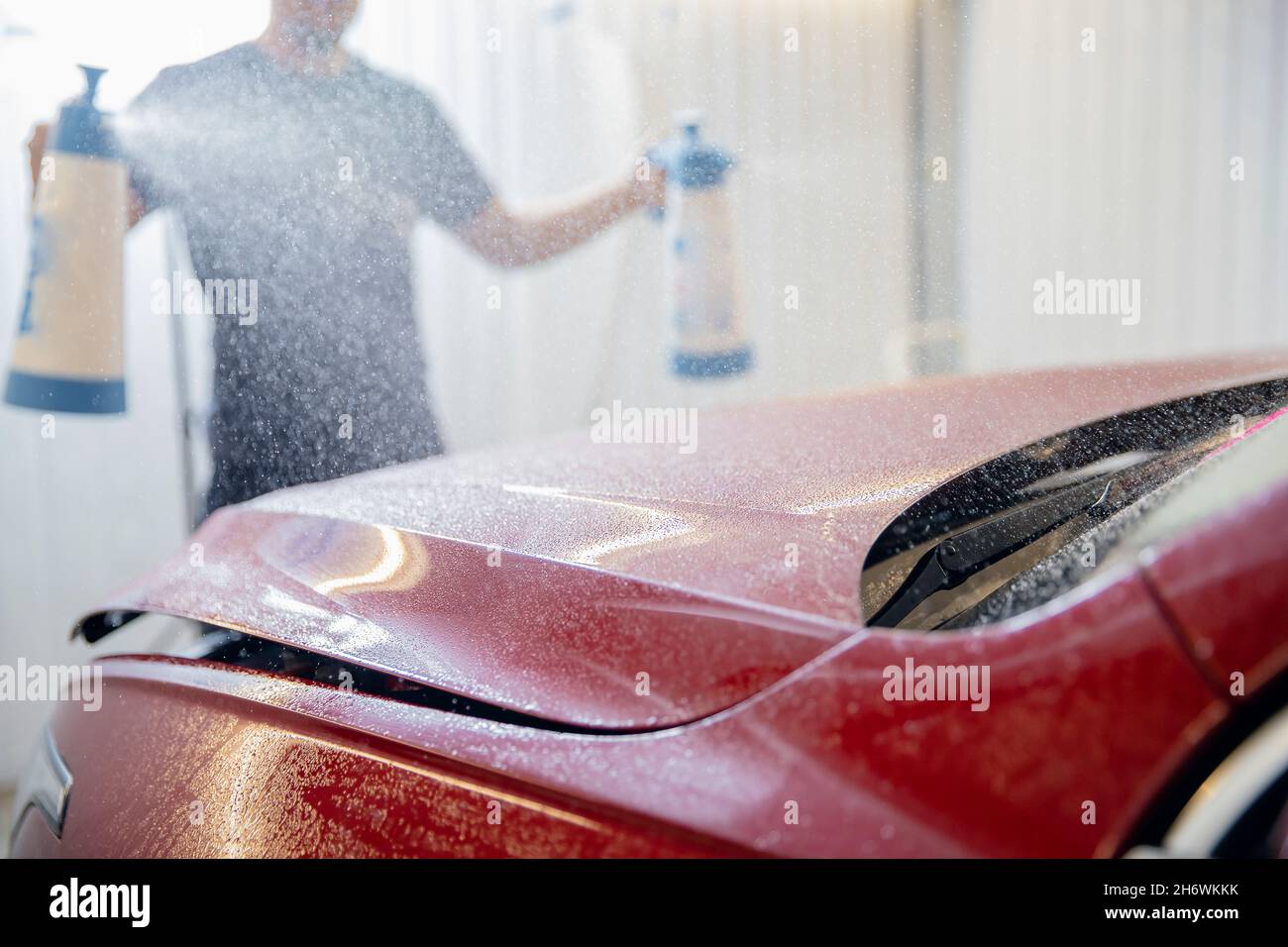 Preparing for pasting protective film vinyl. Manual car wash