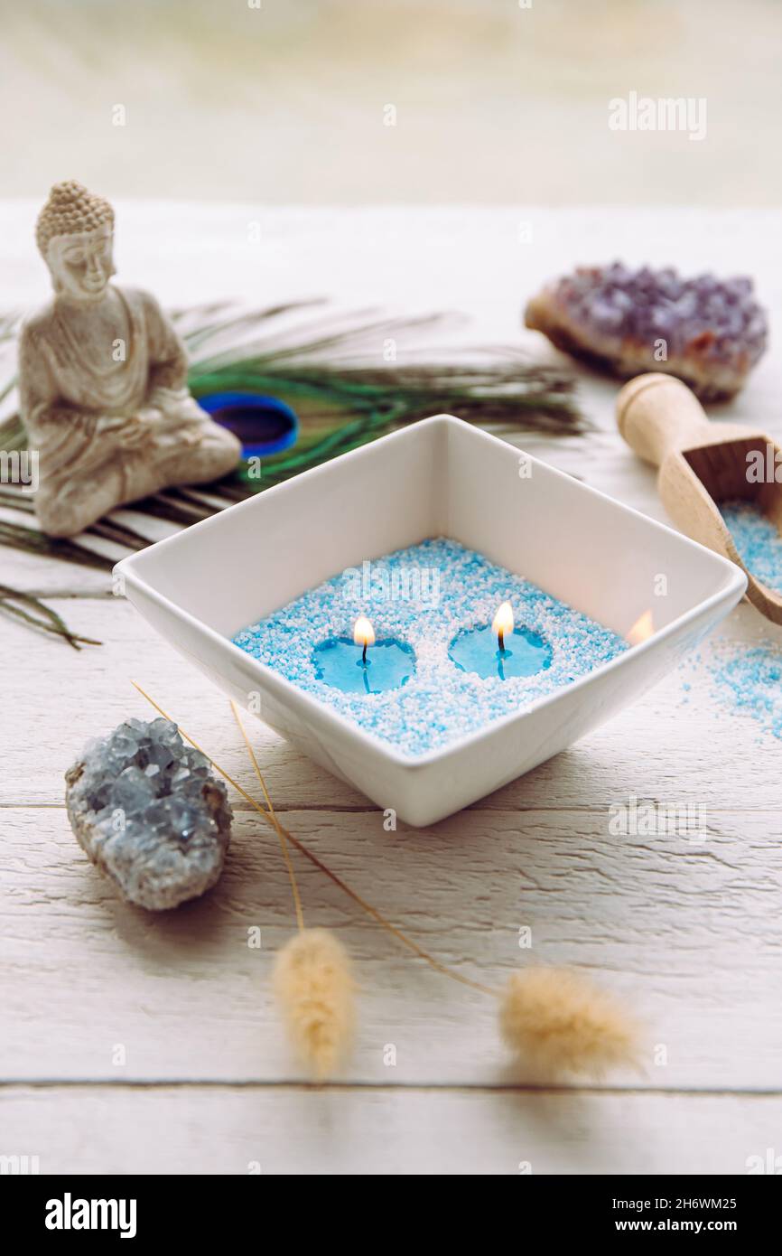 Blue and white granulated wax crystals to create candles by pouring in