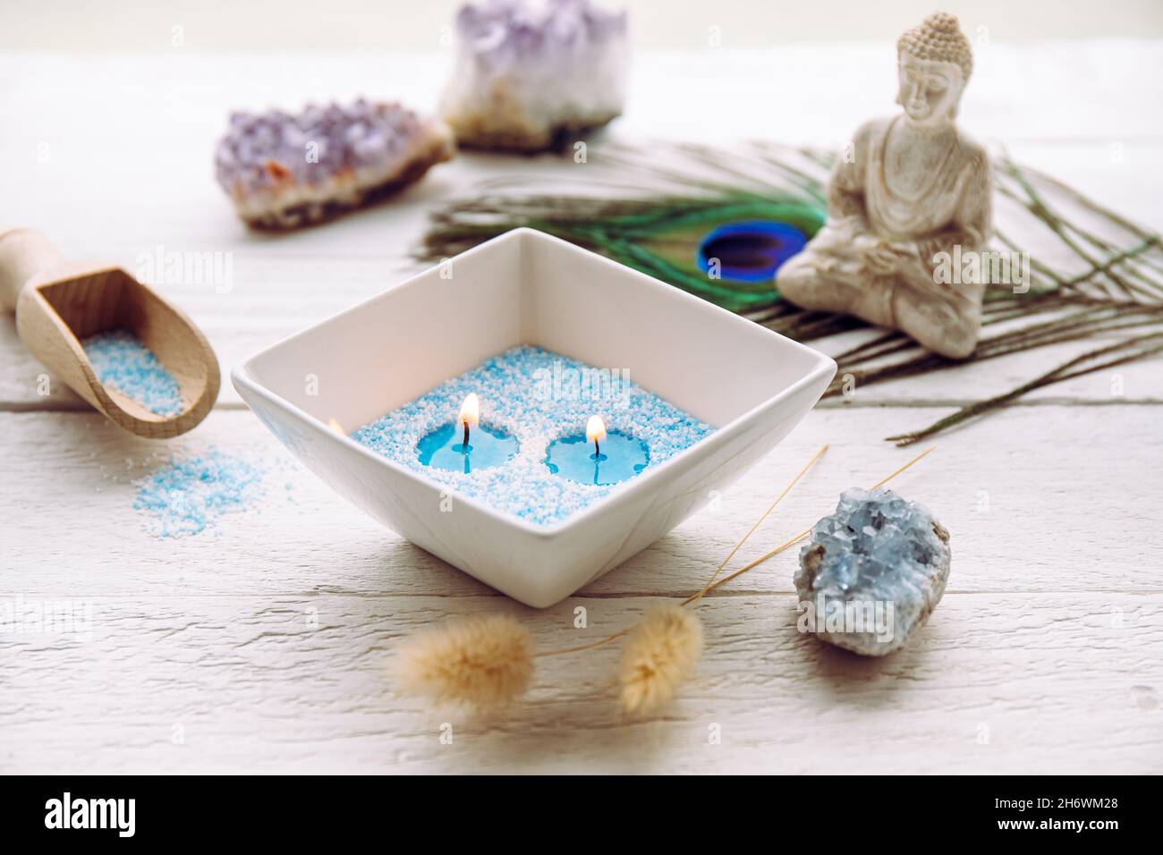 Blue and white granulated wax crystals to create candles by pouring in