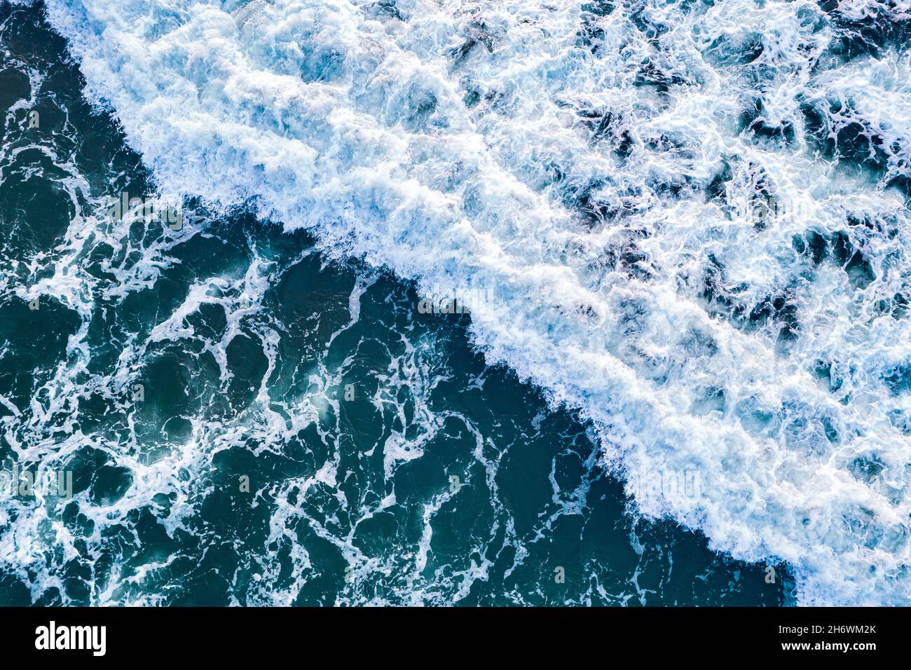 Open sea from aerial top view. Blue water frothy indonesia ocean