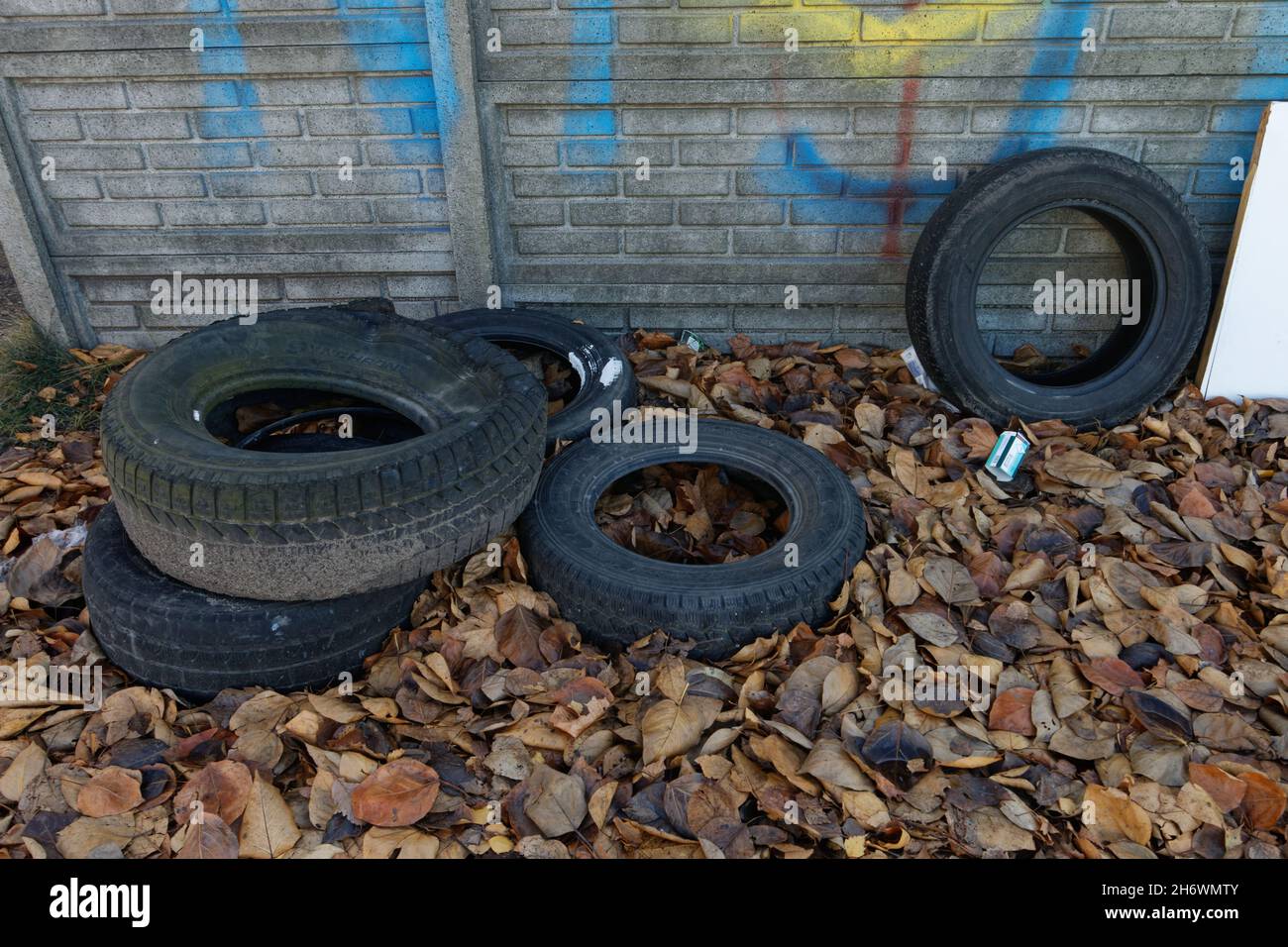 Waste tires recklessly left on the street. Stock Photo