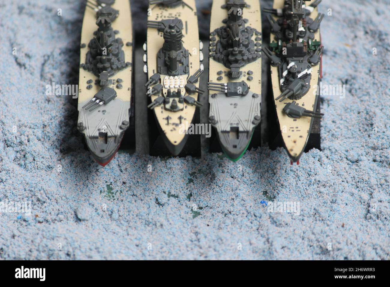 The lineup of miniature battleships consists of the enterprise carrier, the submarine, the battleship Musashi, the battleship Yamato Stock Photo