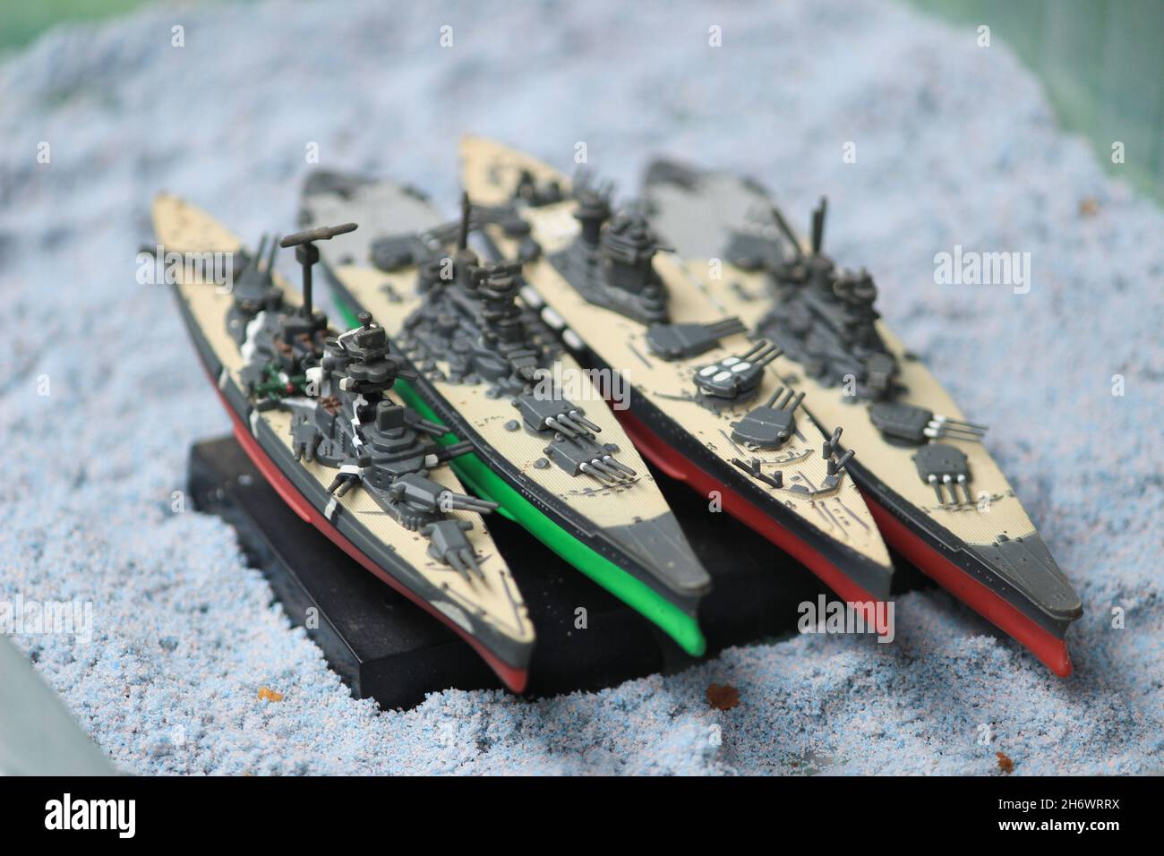 The lineup of miniature battleships consists of the enterprise carrier, the submarine, the battleship Musashi, the battleship Yamato Stock Photo