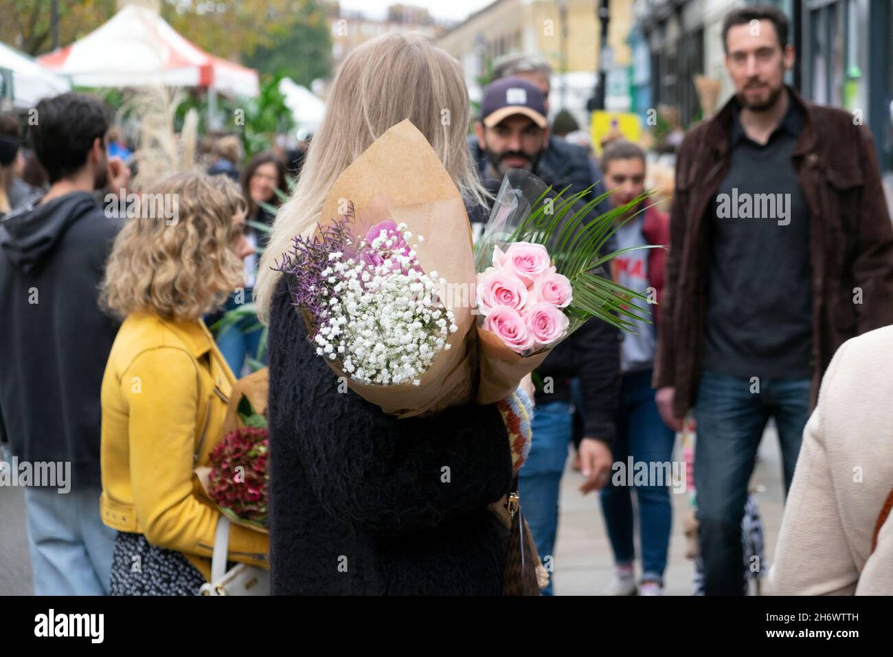 Columbia Road Flower Market people buying plants flowers in the street