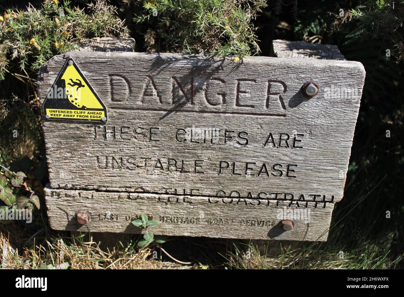 Danger these cliffs are unstable wood sign. Budleigh Salterton. The ...