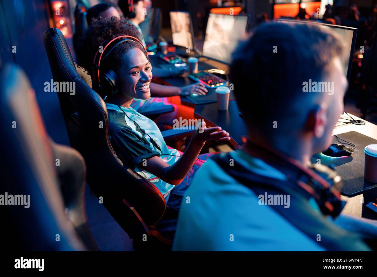 Young gamers participate in online tournament in game club Stock Photo