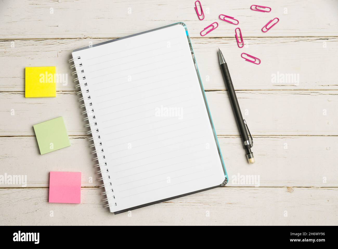 Keyboard Over A Table Beside A Notebook And Pens With Sticky Notes Stock Photo