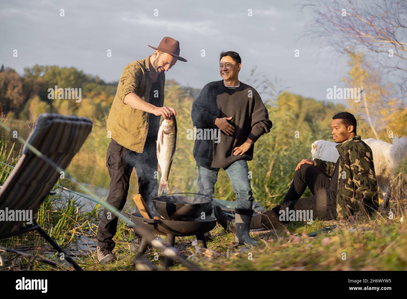 Asian man cooking fish hi-res stock photography and images - Alamy