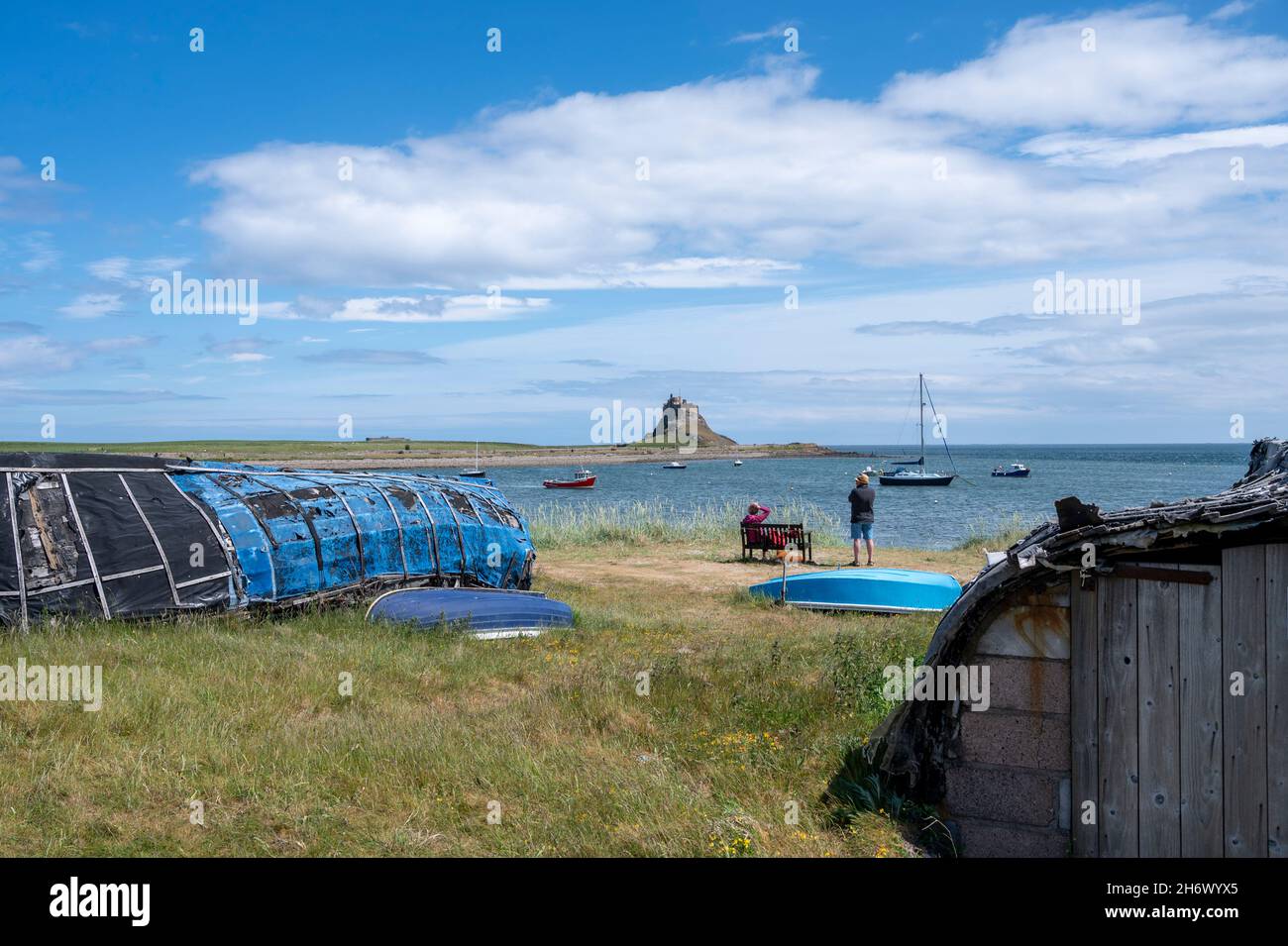 Scenic view from Holy Island Harbour, Lindisfarne, across to Lindisfarne Castle on a sunny day. Stock Photo