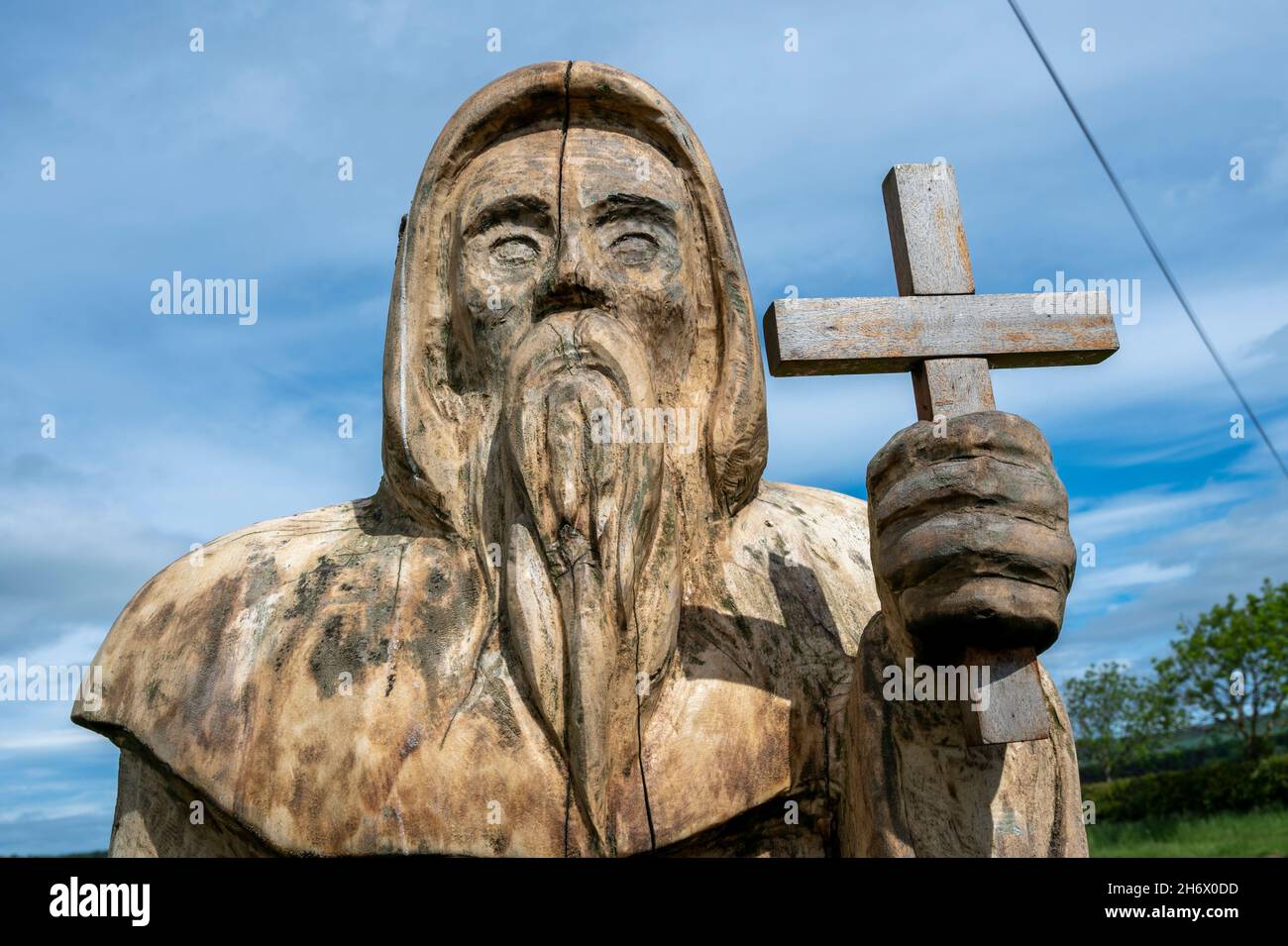A wooden sculpture of St Cuthbert, on St Cuthbert's way pilgrimage route. Stock Photo