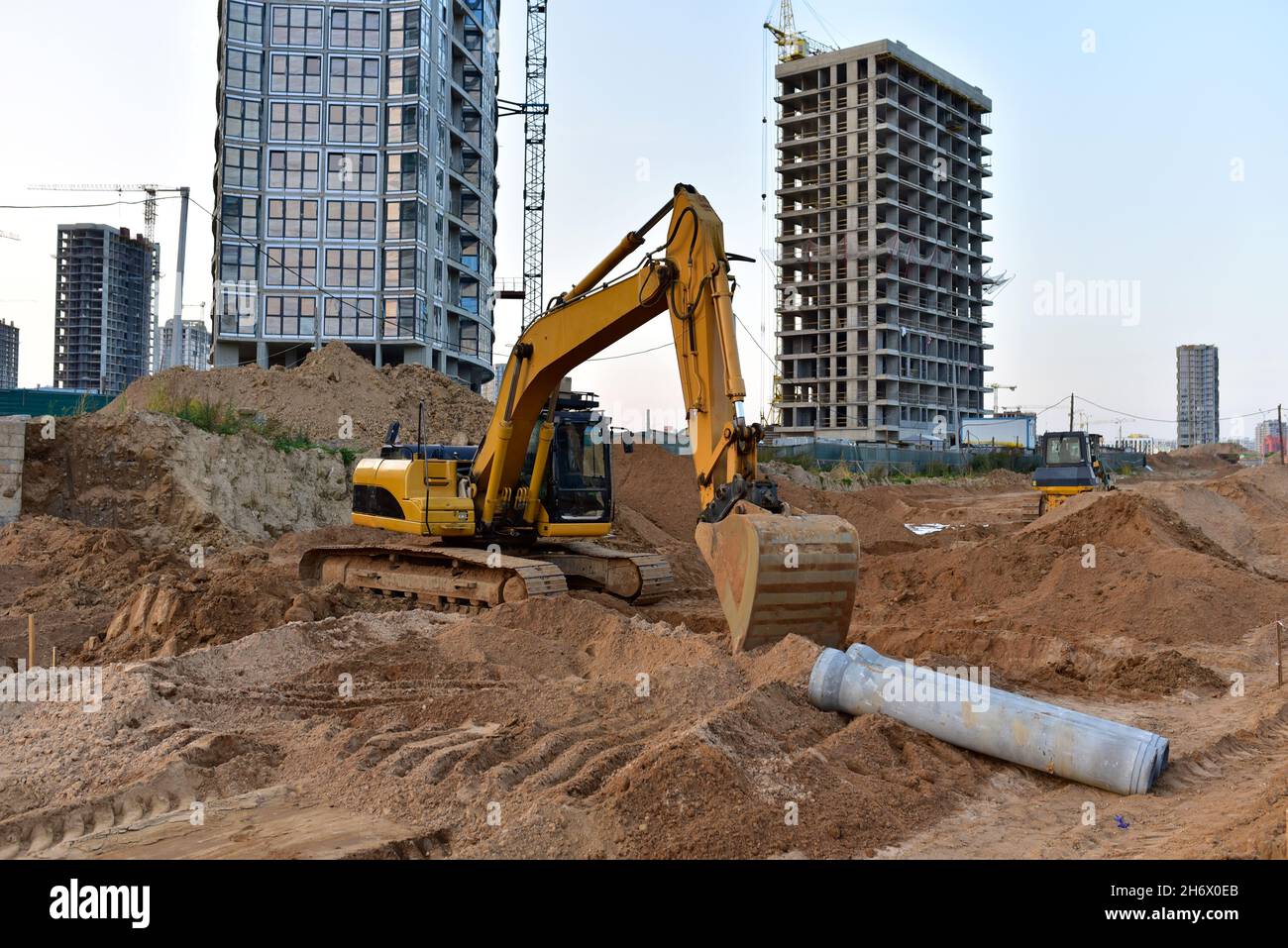 Excavator dig the trenches at a construction site. Trench for laying