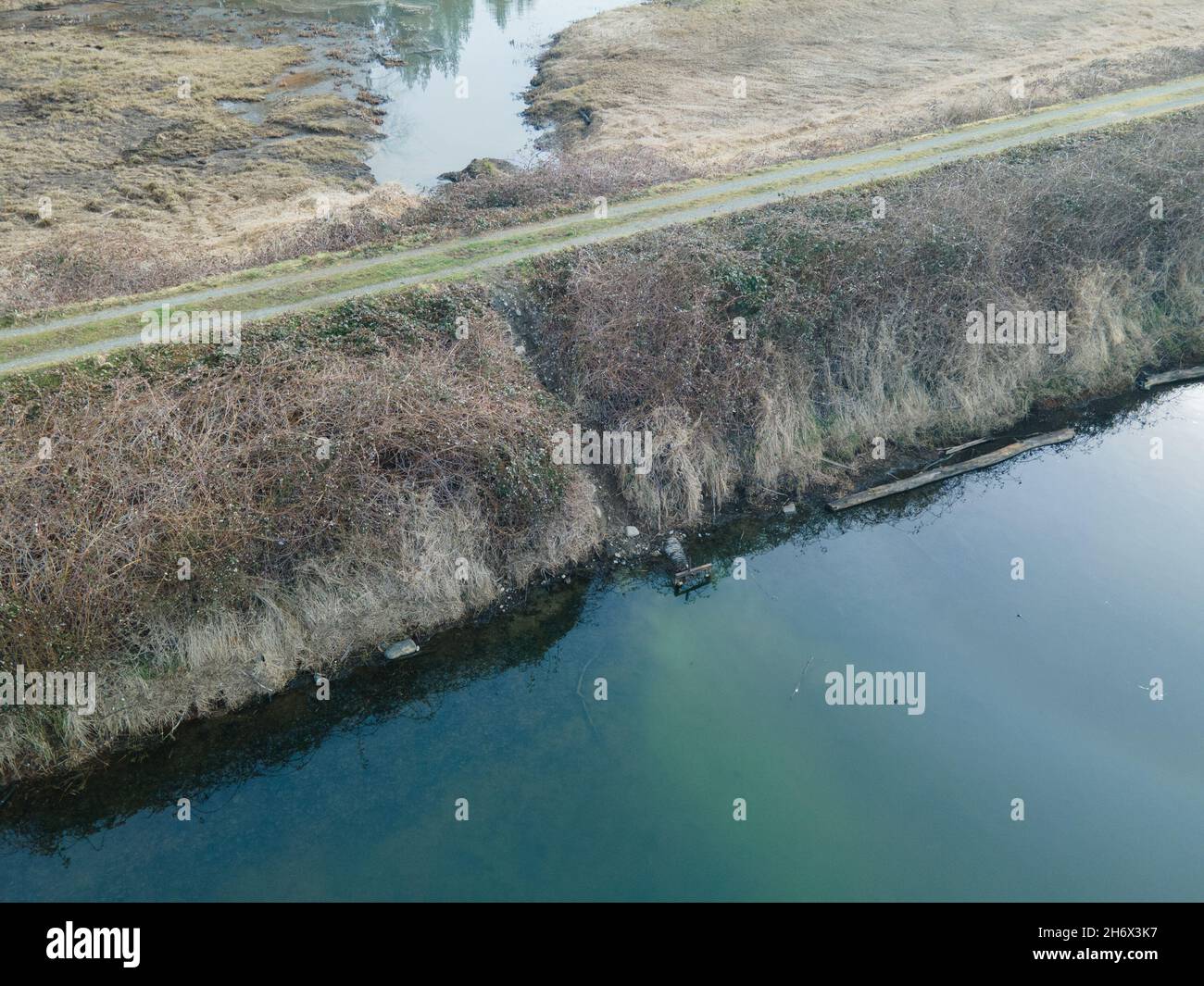 Old flood gate in a flood dike in the Suma prairie in the Lower Fraser Valley, Stock Photo