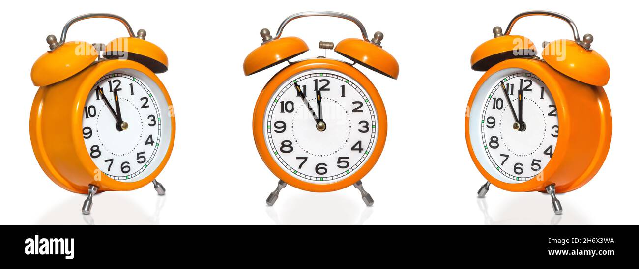 set of vintage orange alarm clocks isolated on white background
