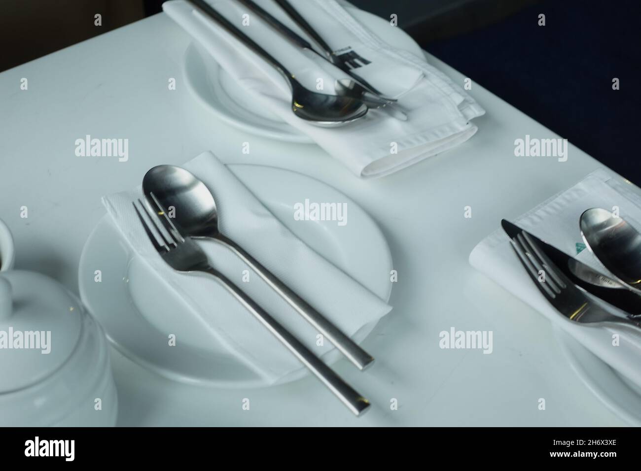 cutlery and empty plate on white background  Stock Photo