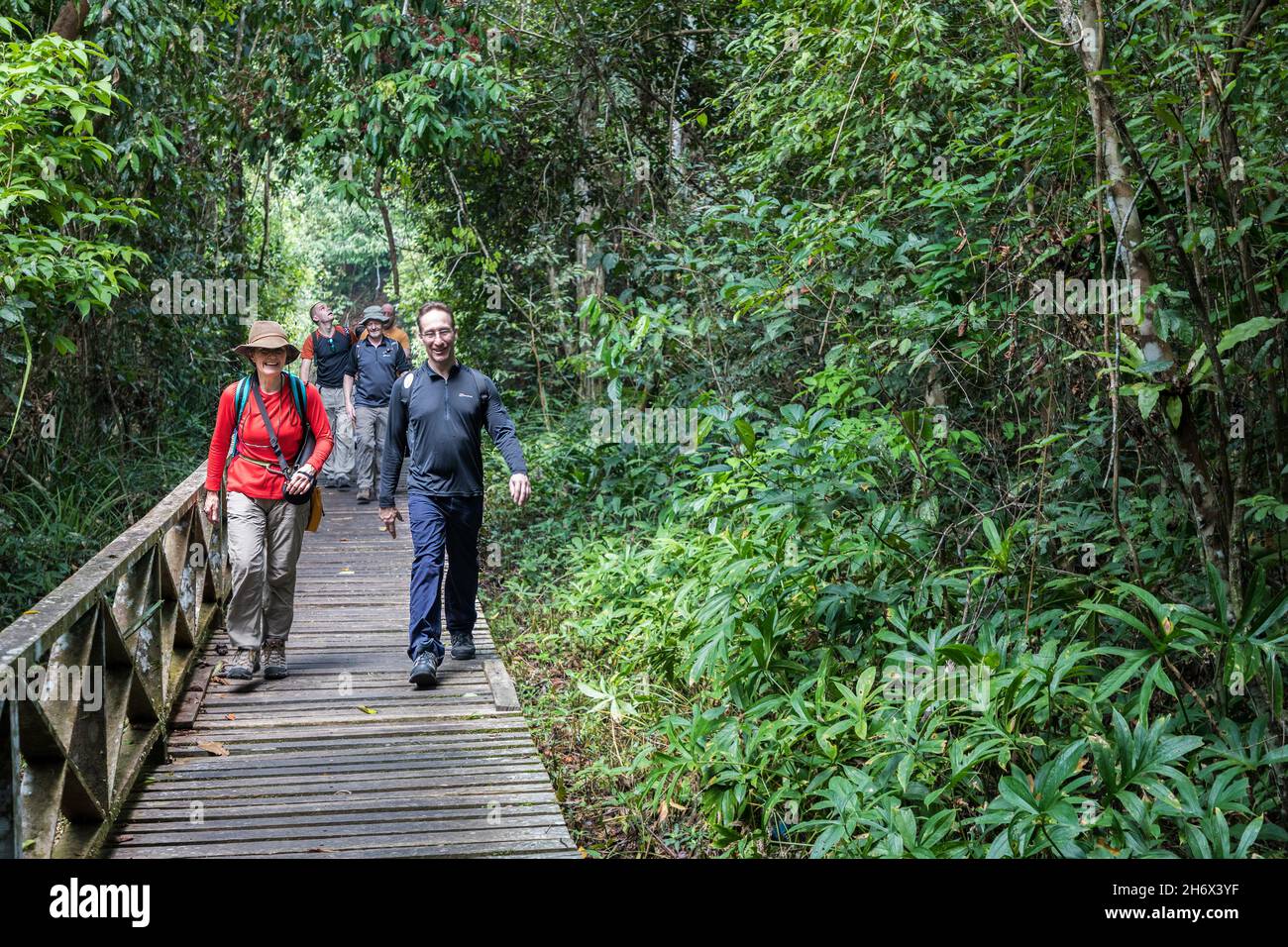 People on the boardwalk to Niah cave, Malaysia Stock Photo