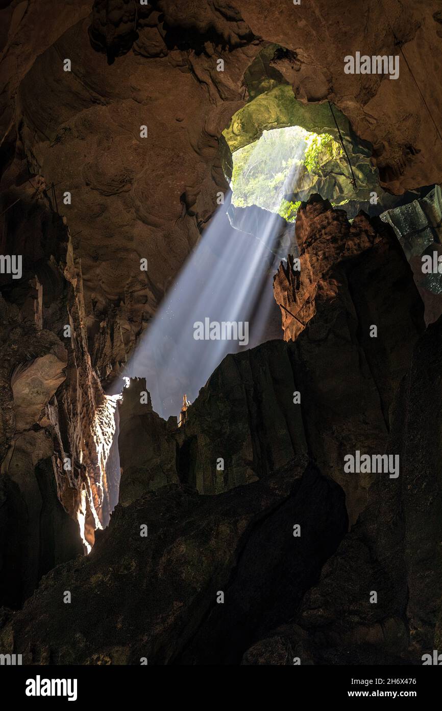 Shaft of light through skylight, Niah cave, Malaysia Stock Photo