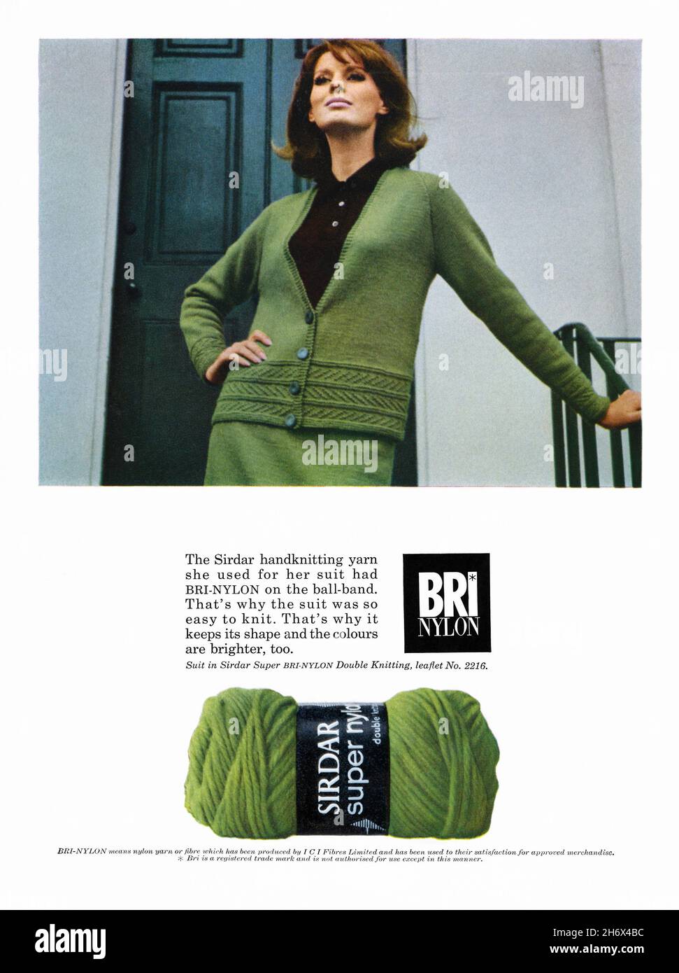 A 1960s advert for Bri-Nylon. The advert appeared in a magazine published in the UK in March 1965. The photograph shows a woman wearing a green knitted suit made from the yarn, plus a ball of ‘wool’ is below. Nylon is a generic name for a family of synthetic polymers composed of polyamides, generally made from petroleum. It was formulated in a DuPont laboratory in Delaware, USA. In 1939 ICI, in the UK, took out a licence to make nylon fibre. In 1958 the trademark name Bri-Nylon was established – vintage 1960s graphics for editorial use. Stock Photo