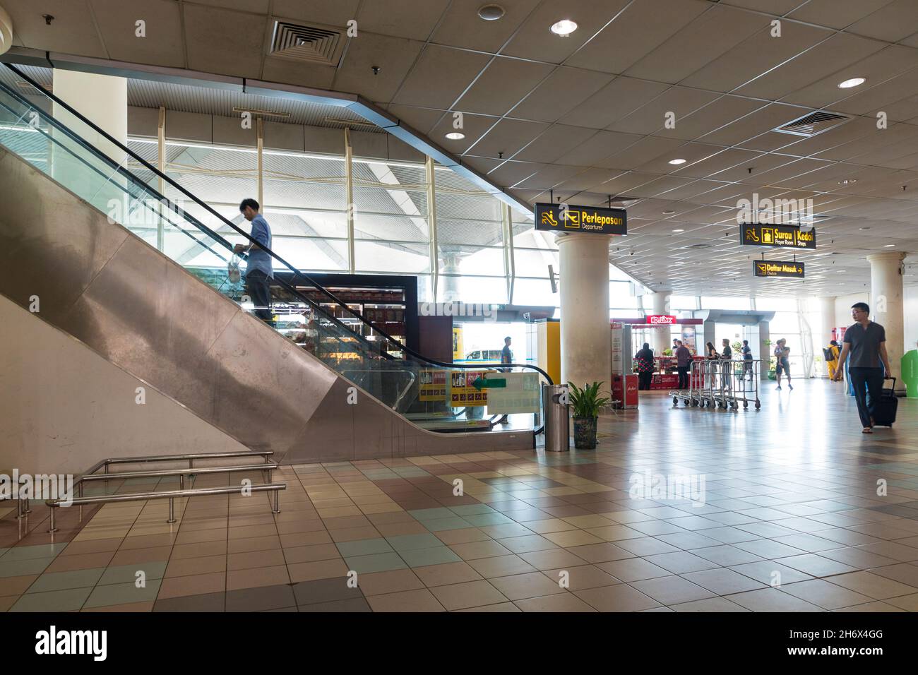 Passengers at airport, Miri, Malaysia Stock Photo