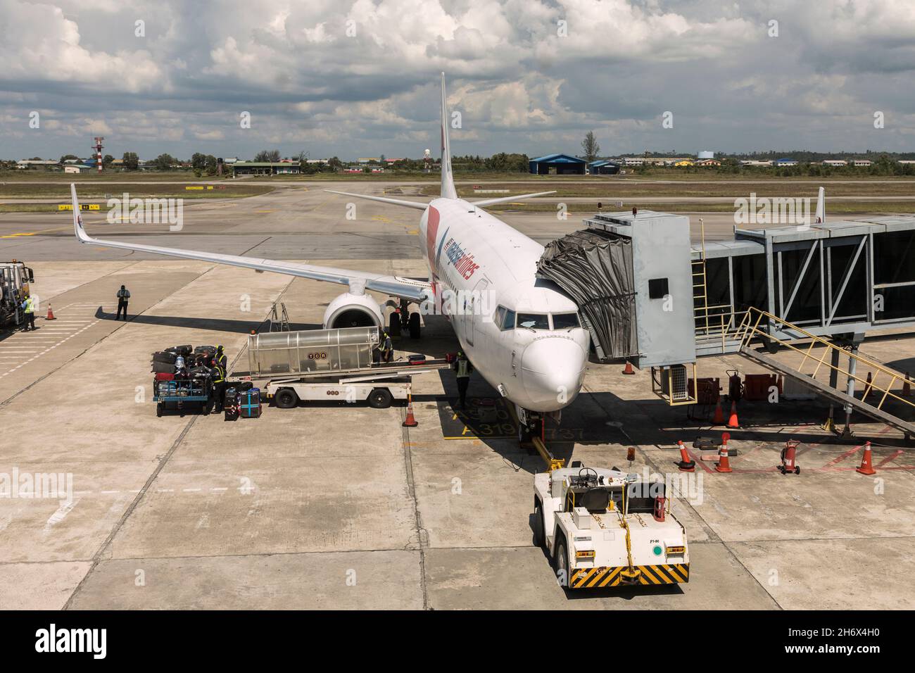 Malaysia Airlines baggage being loaded onto aircraft, Miri, Malaysia Stock Photo