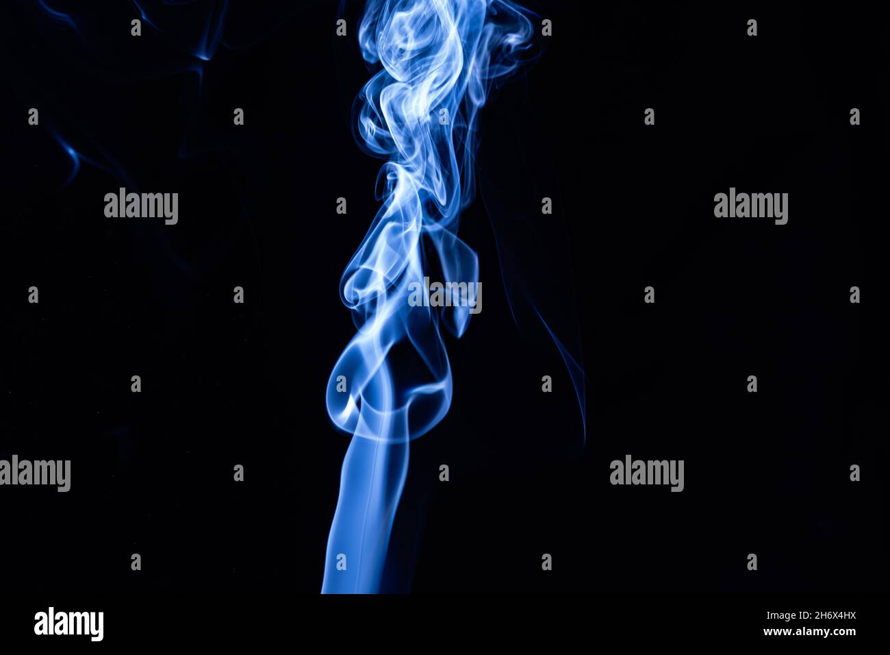 Blue color abstract smoke on black background Stock Photo - Alamy