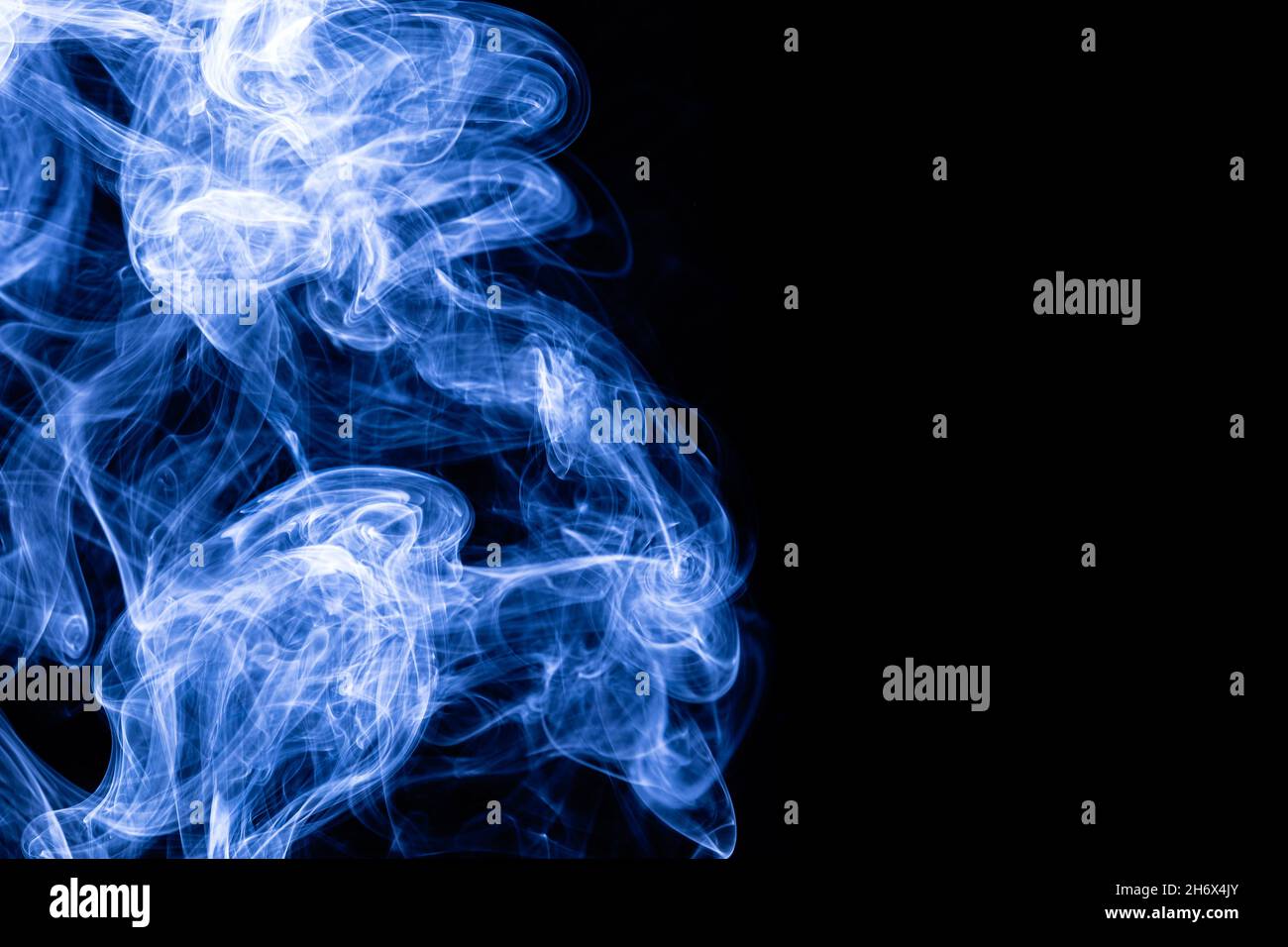 Blue color abstract smoke on black background Stock Photo - Alamy