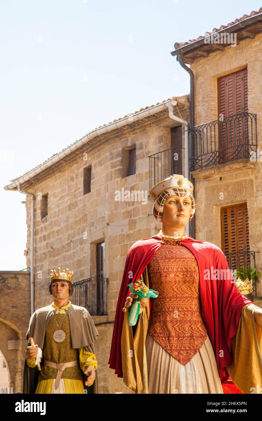 The Giants and big head festival fiesta  parade in the Plaza Mayor at the Spanish town of Olite Navarra Northern Spain Stock Photo