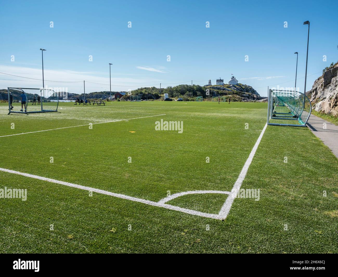 Football stadium on rocky island, fishing village Henningsvaer, Lofoten