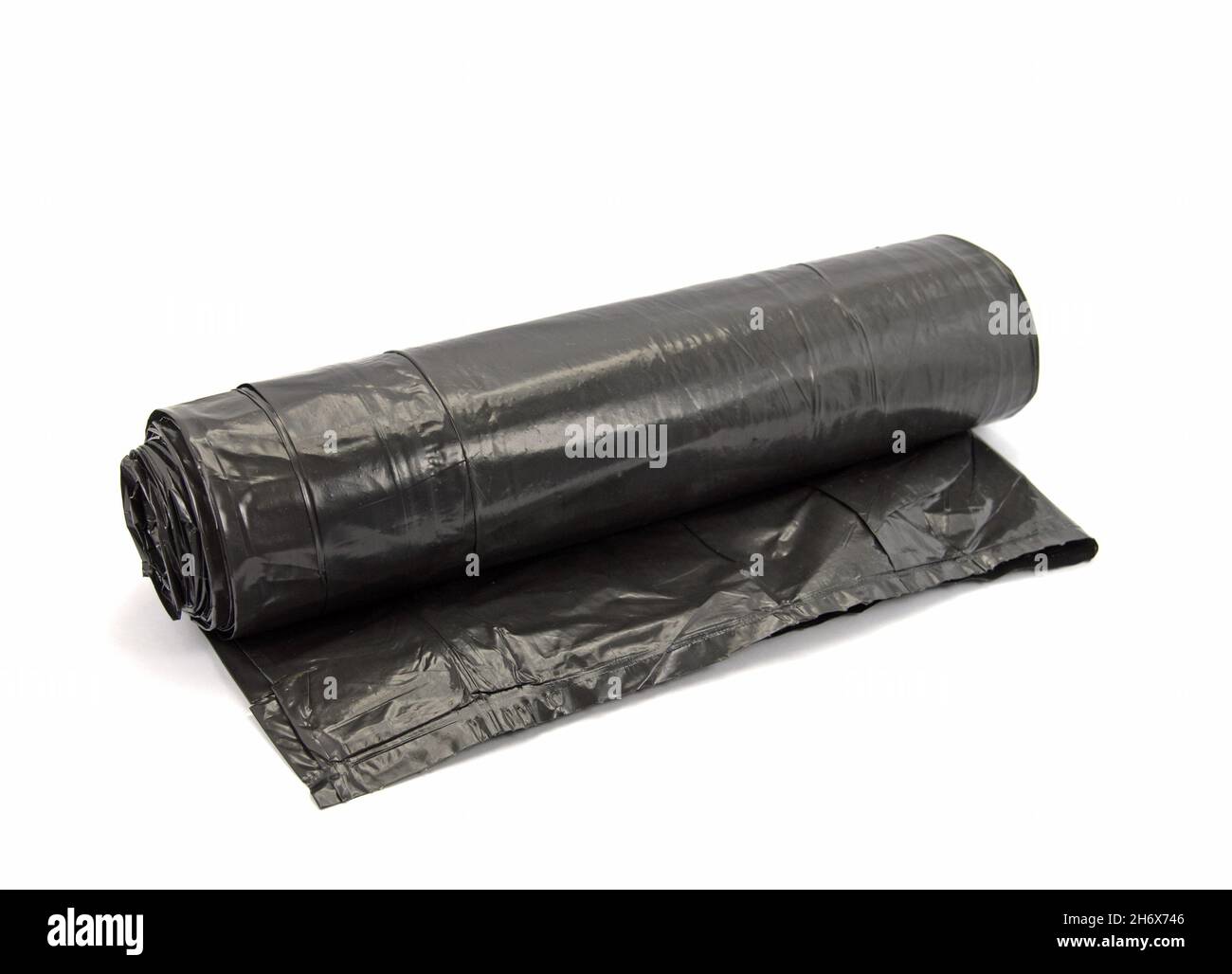 Black garbage bags against a white background Stock Photo