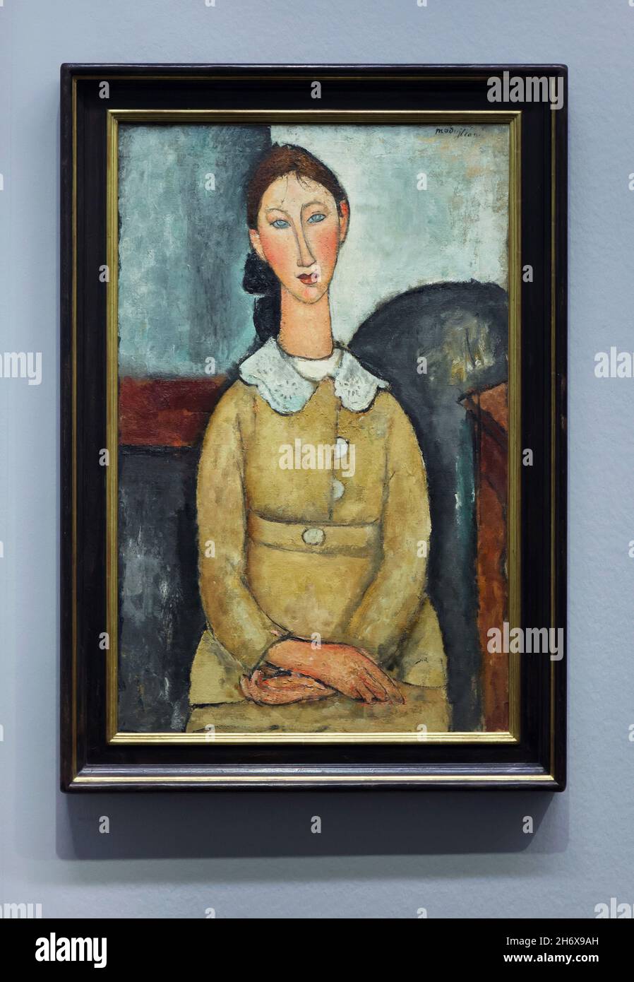Painting 'Girl in a Yellow Dress' by Italian modernist painter Amedeo Modigliani (1917) on display at his retrospective exhibition in the Albertina Museum in Vienna, Austria. The exhibition marking the centenary of artist's death runs till 9 January 2022. Stock Photo